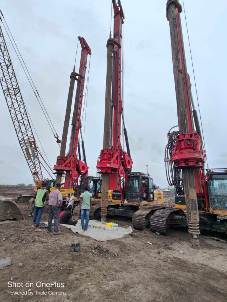 3 Piling Rigs and a crane